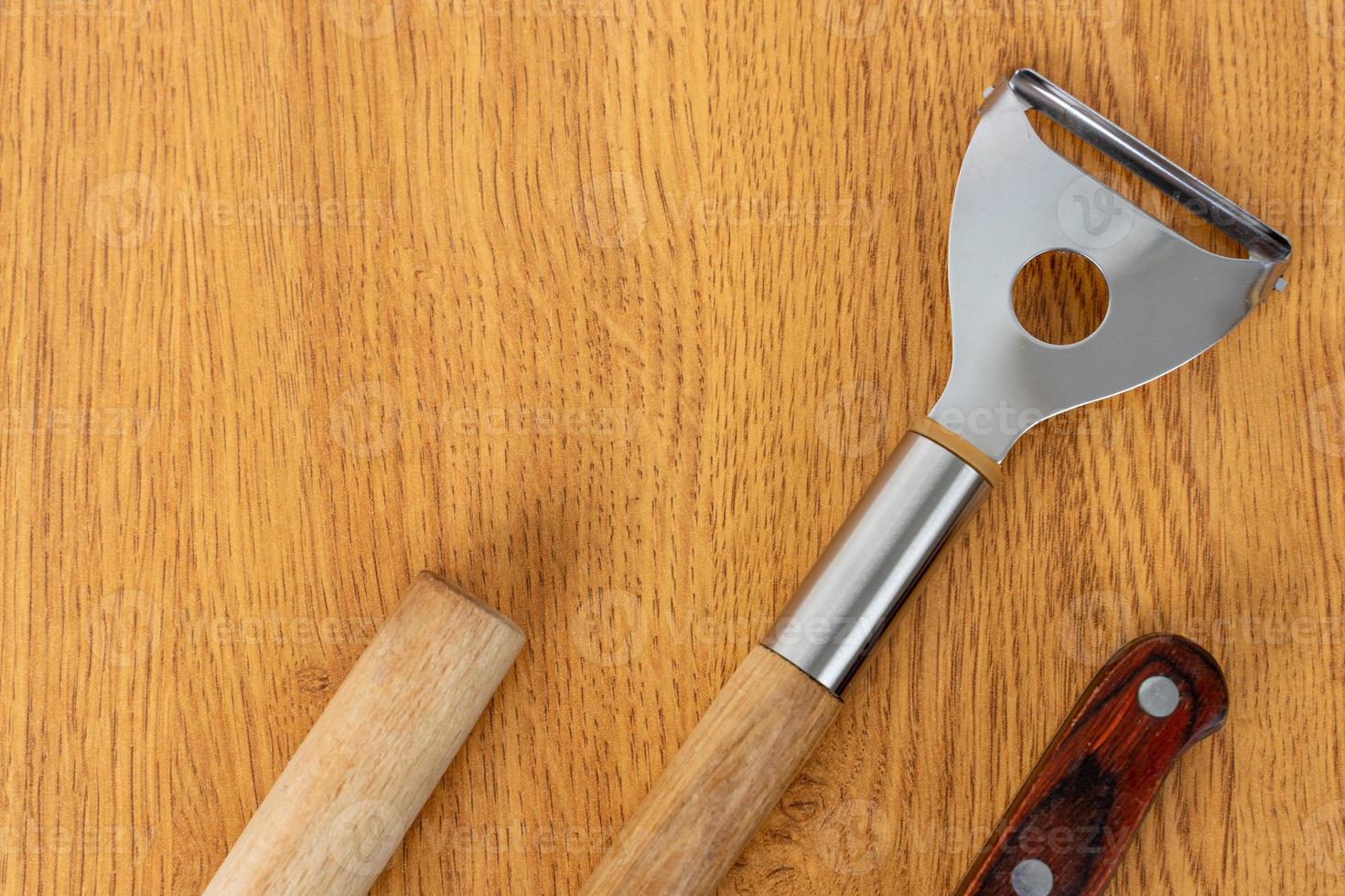 Kitchen utensils on a wooden background photo