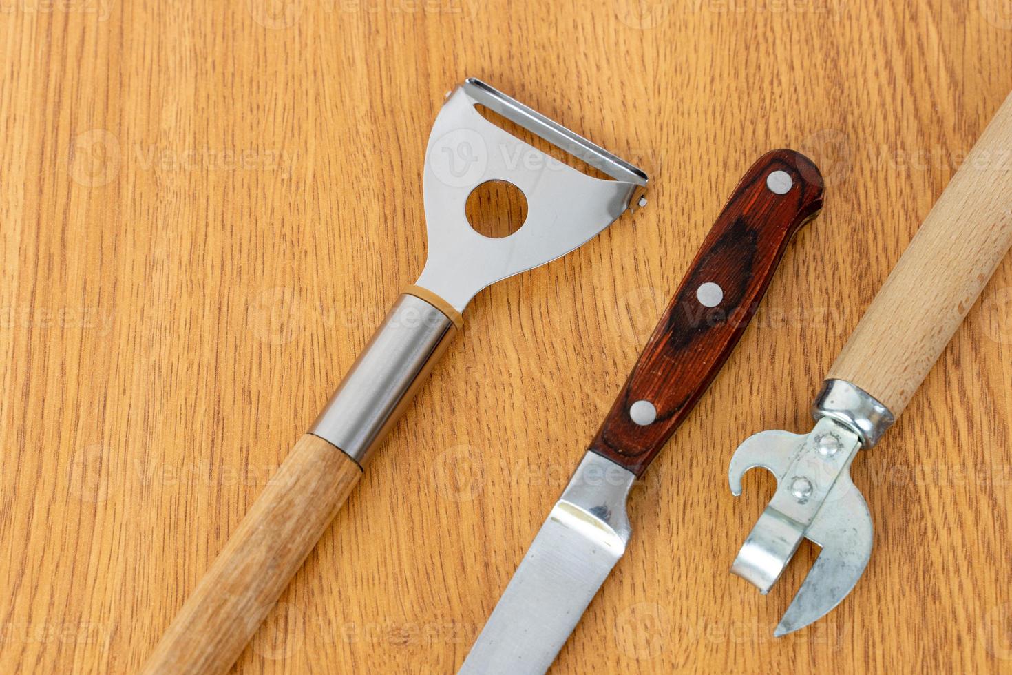 Kitchen utensils on a wooden background photo