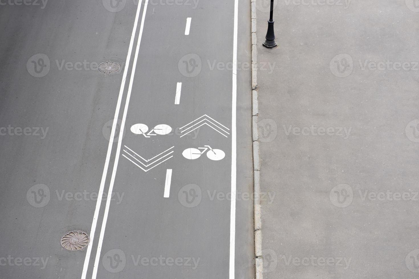 Bike path in the park top view. Road markings. Pedestrian zone. photo