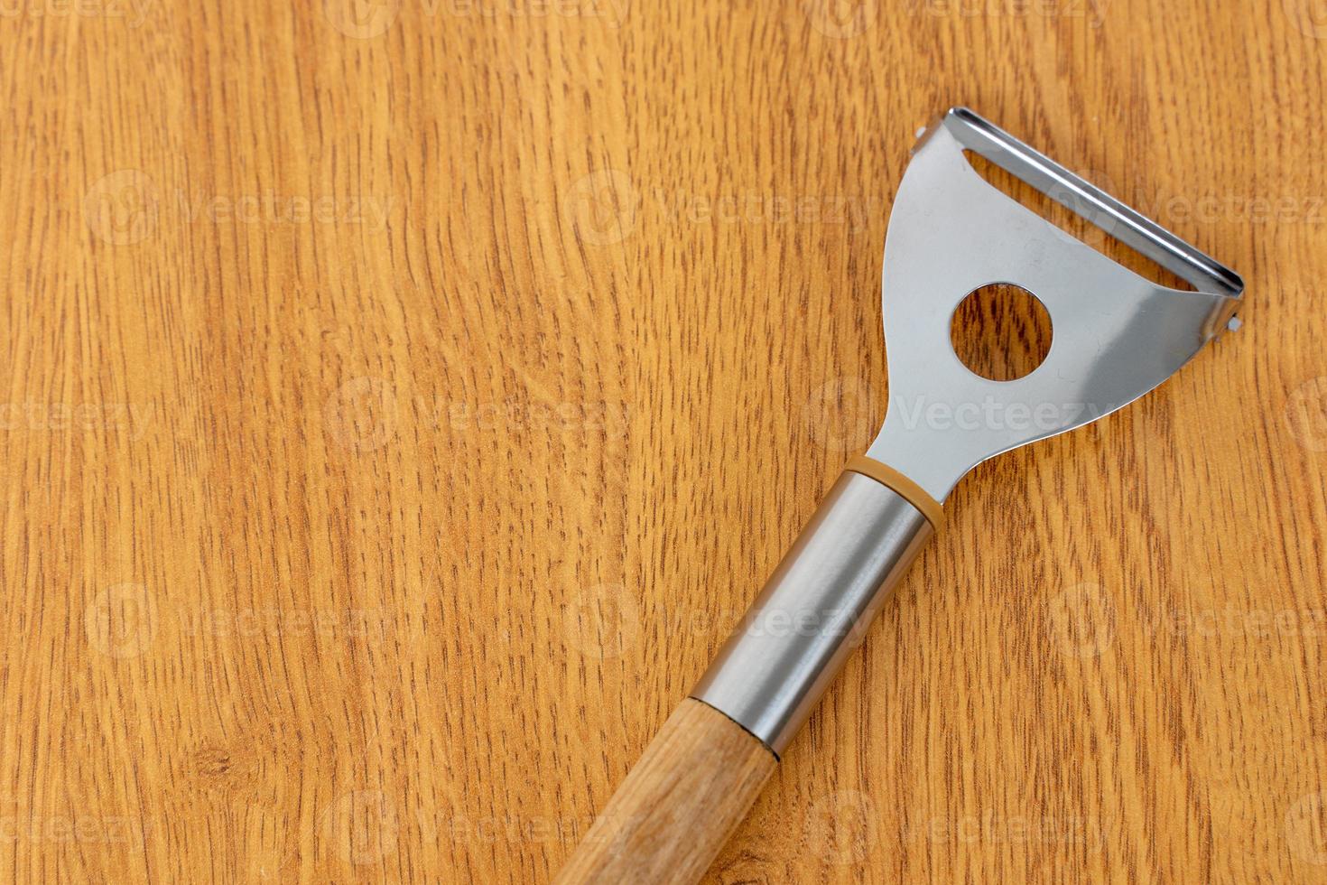 Kitchen utensils on a wooden background photo
