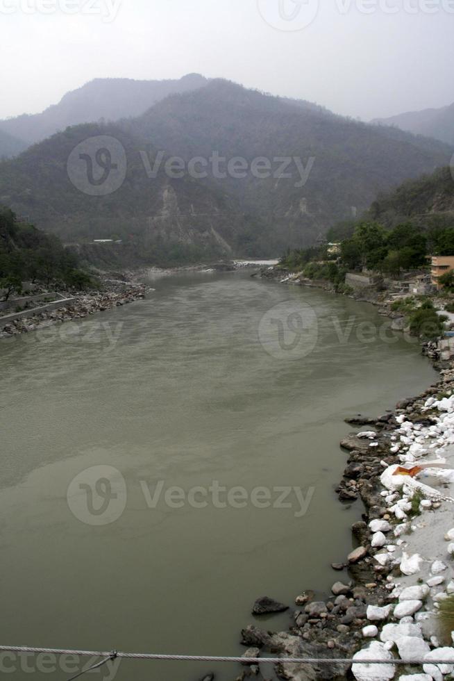 River Ganga Flowing Between Mountains photo