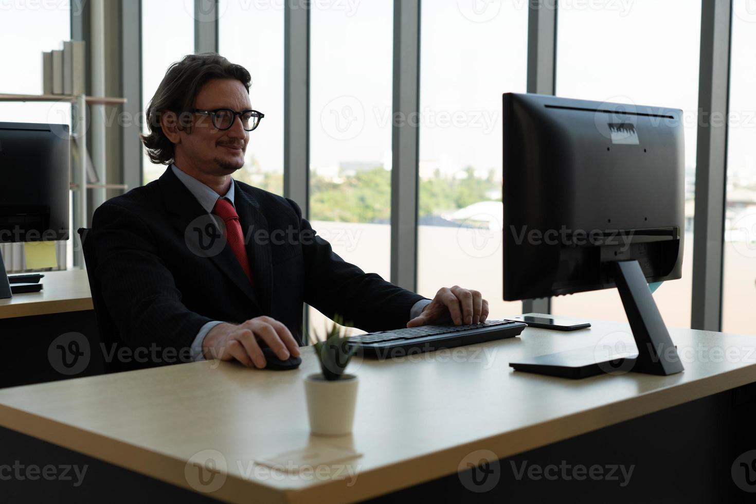 Middle Age Businessman Working in Office photo