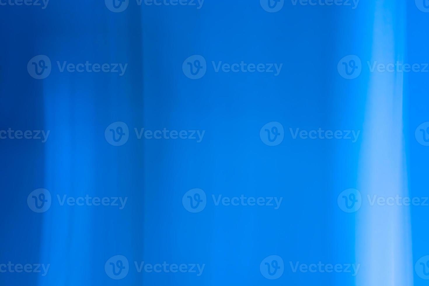 Abstract background banner in blue tones with shadows, glare, vertical lines, waves. photo