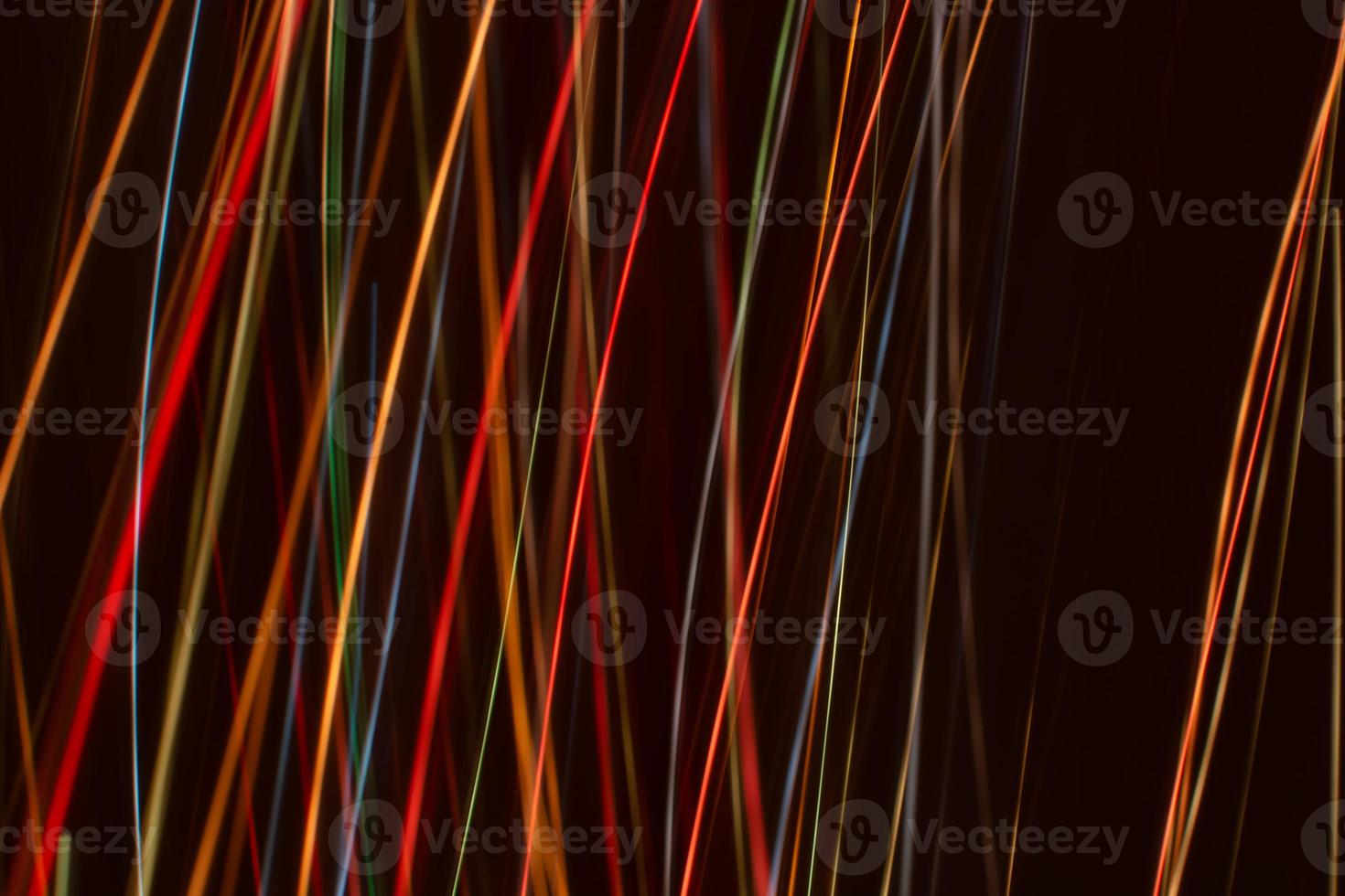 Bright multicolored diagonal and vertical lines of rays on. Abstract dark banner background. photo