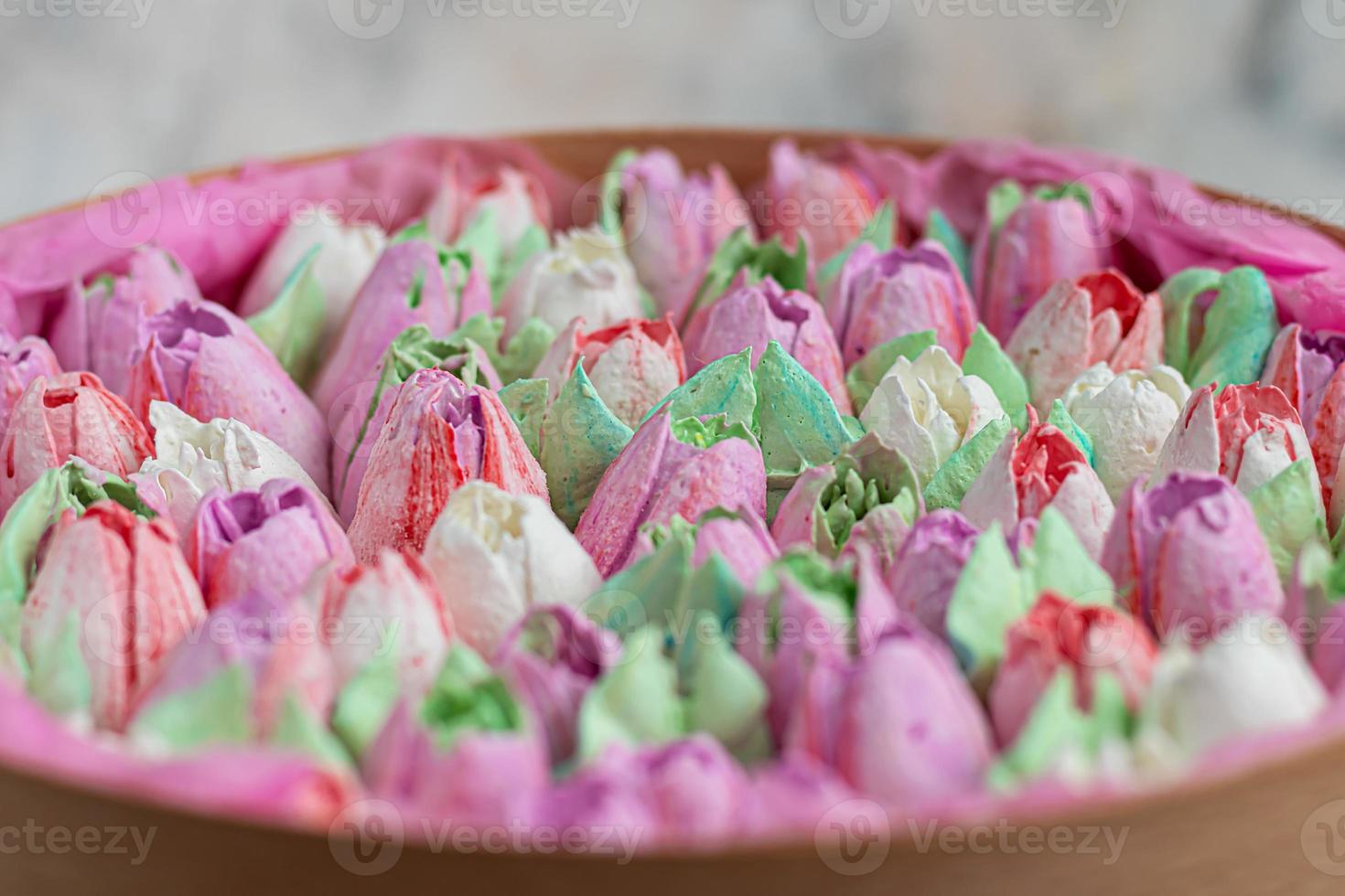 Handmade marshmallows in wooden packages on a light background with flowers. The concept of the holidays Women's Day and Valentine's Day. photo