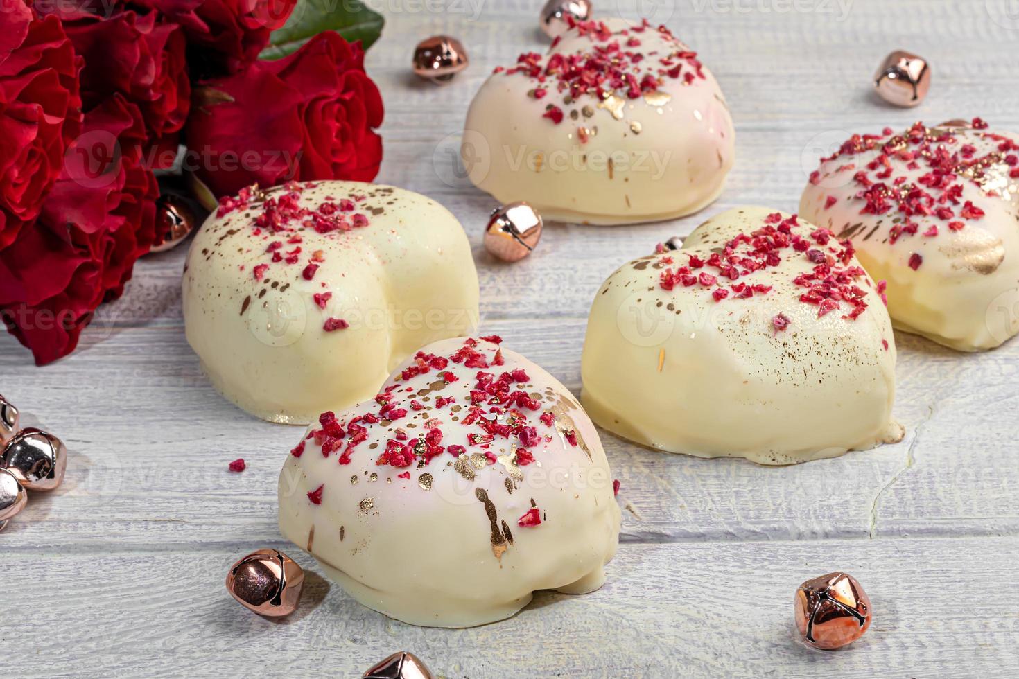 Handmade gingerbread in white chocolate on a light background. Festive packaging. photo