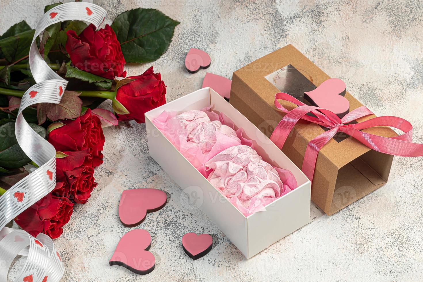 Marshmallow gift handmade on a light background. In transparent boxes. Festive packaging. photo