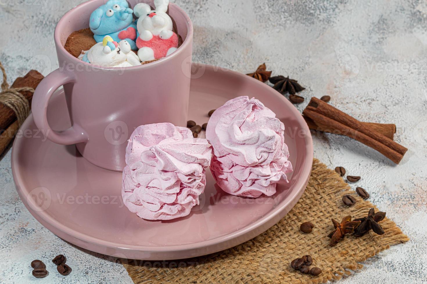 Marshmallow in the form of handmade animals on a light background. In a cup of coffee. Women's Day, Valentine's Day. photo