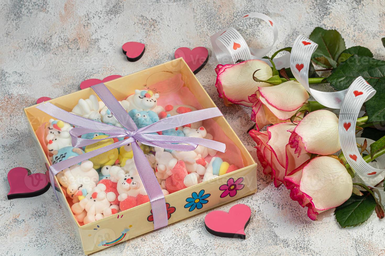 Marshmallow in the form of handmade animals on a light background. In a cup of coffee. Women's Day, Valentine's Day. photo