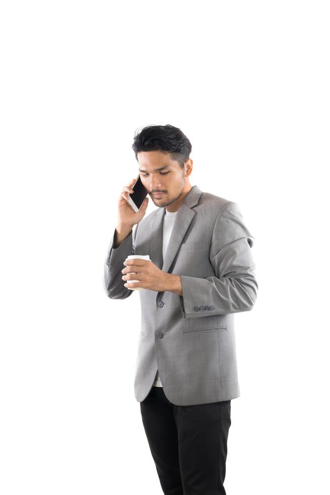 Businessman hipster holding coffee and talk on the phone isolated white background. photo