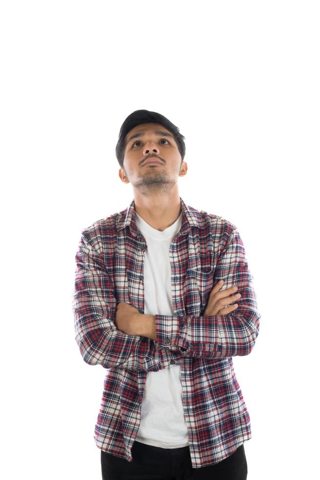 Portrait of a young hipster man standing isolated on a white background photo