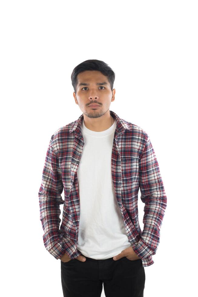 Portrait of a young hipster man standing isolated on a white background photo