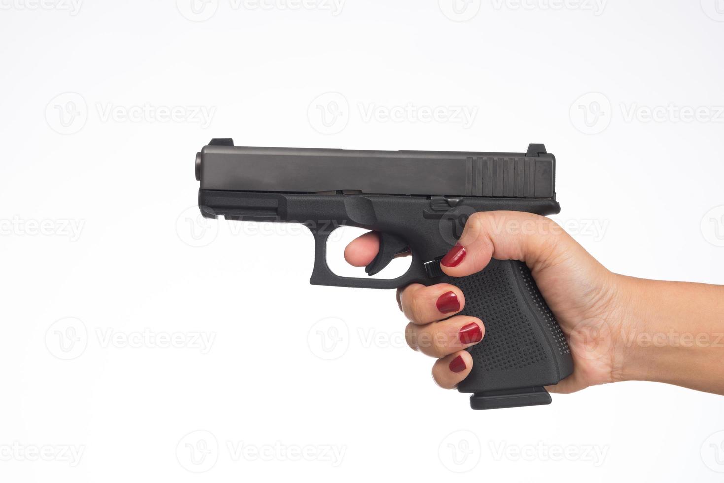 young woman asian girl holding a gun aiming at the gun white background photo