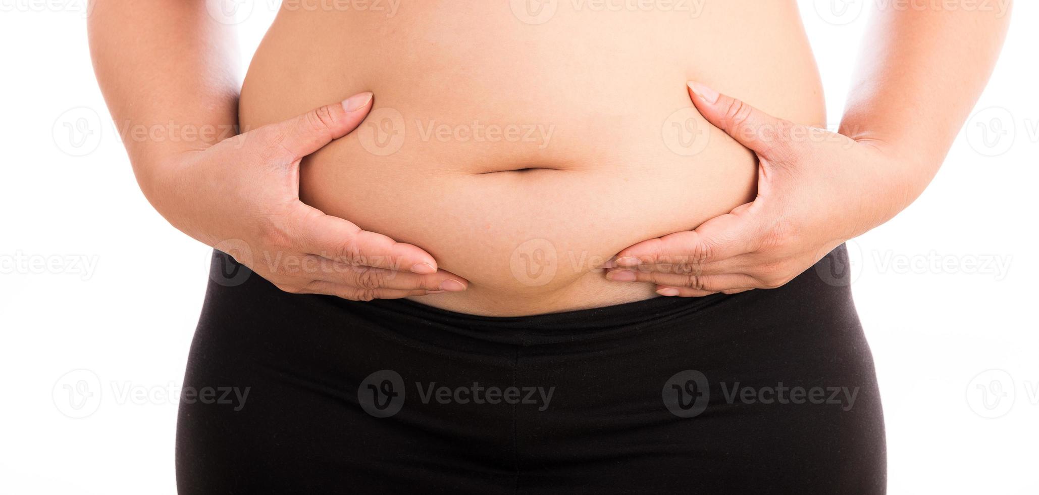 Women with fat belly on white background photo