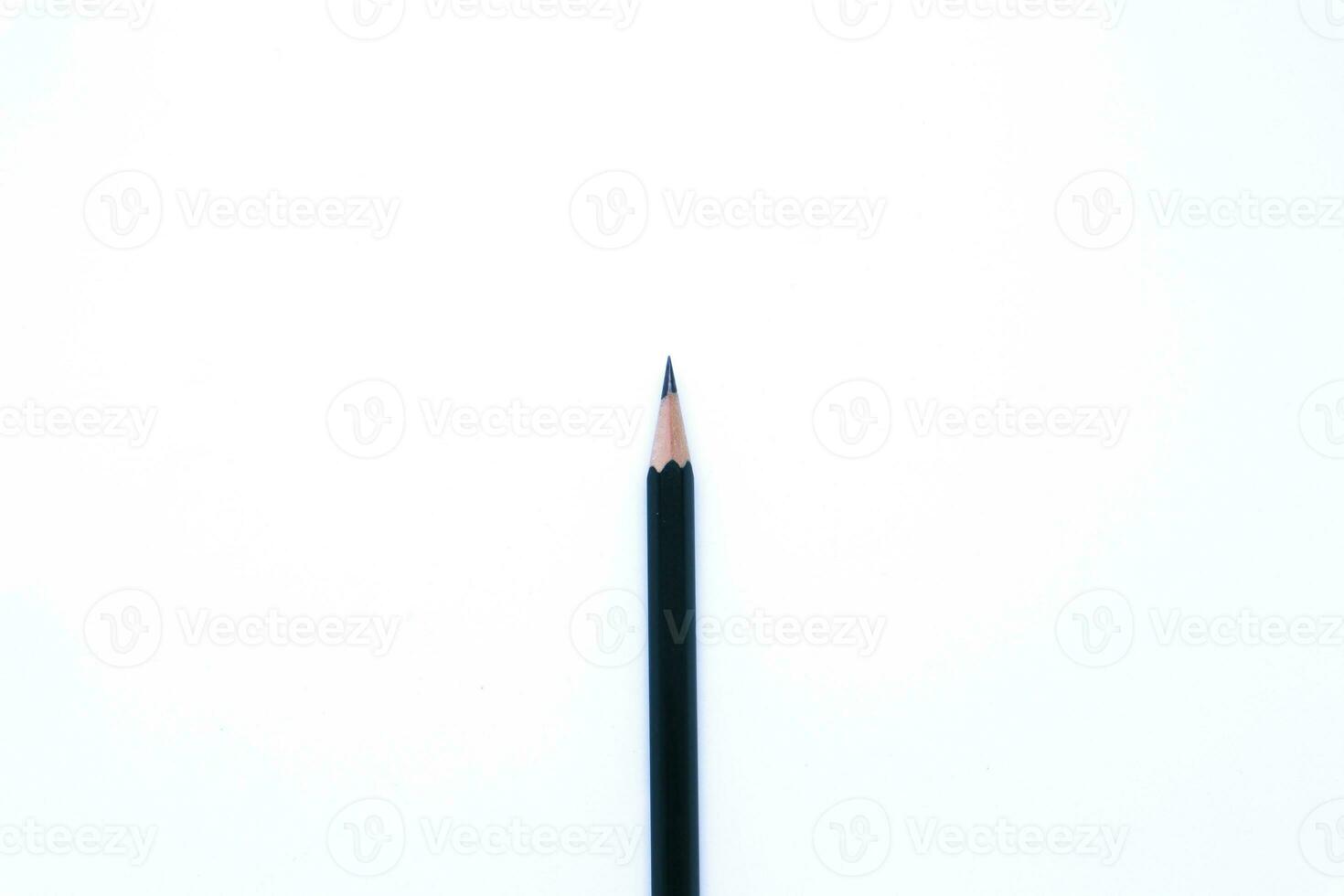 Flat Lay Shot of A Black Pencil in The White Background, Landscape Mode and Minimalist photo