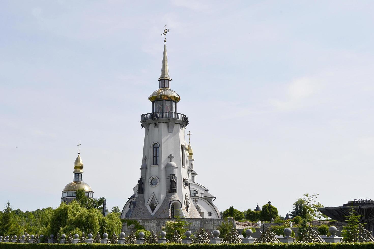 Christian church cross in high steeple tower for prayer photo