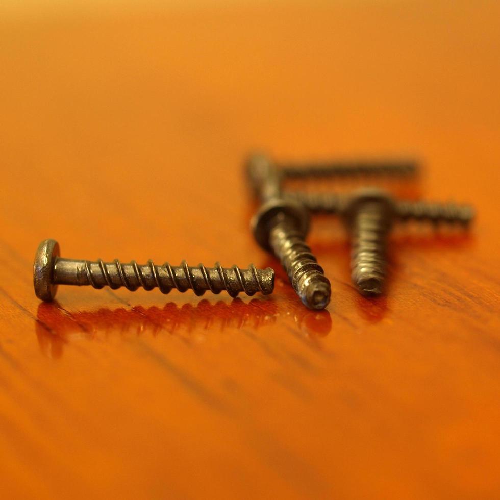 Wood screws on table photo