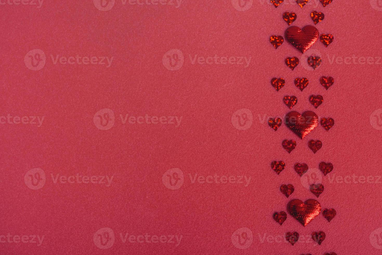 Valentines day background with red hearts on red background, flat lay, copy space photo