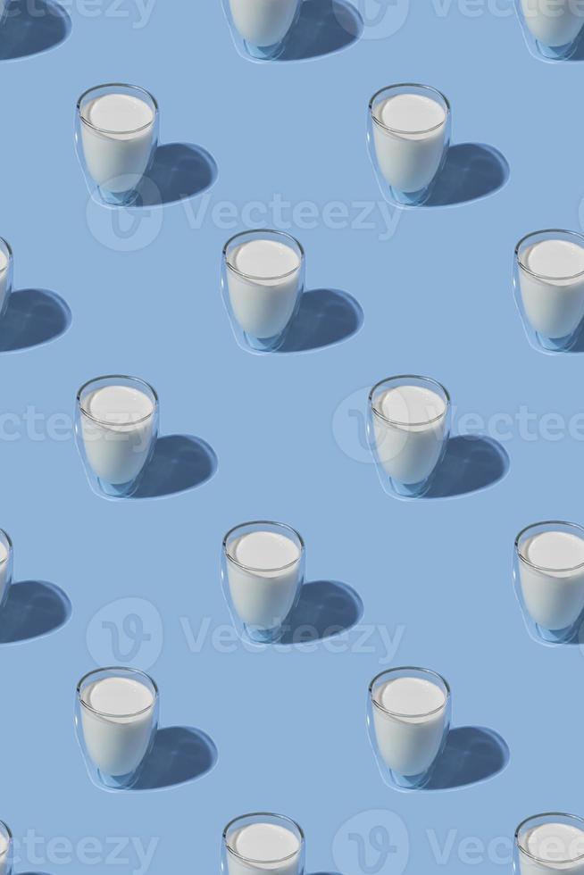 World Milk Day. Pattern on a blue background. A glass of milk. Sample. Vertical photo