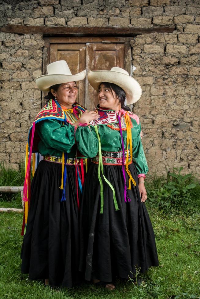 Peruvian andean womans posing in diferents actions photo