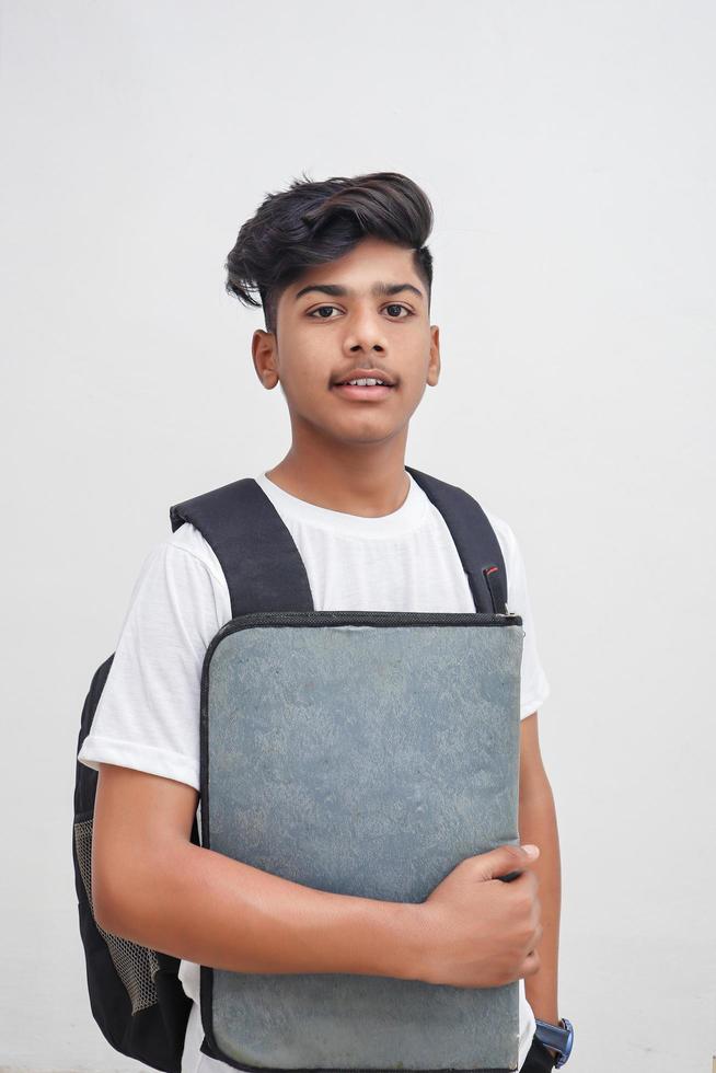 Young indian student holding file in hand. photo