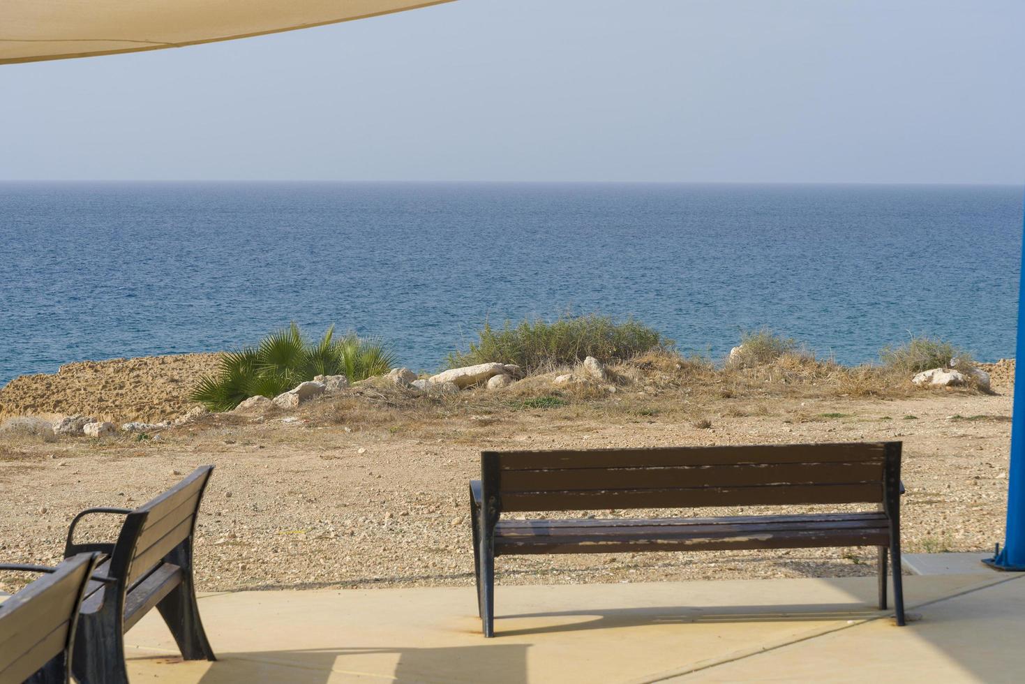 Benches overlooking the sea on the island of Cyprus, near Paphos. photo