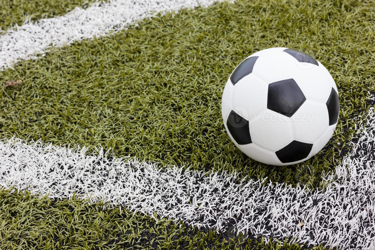 Soccer ball on field texture photo