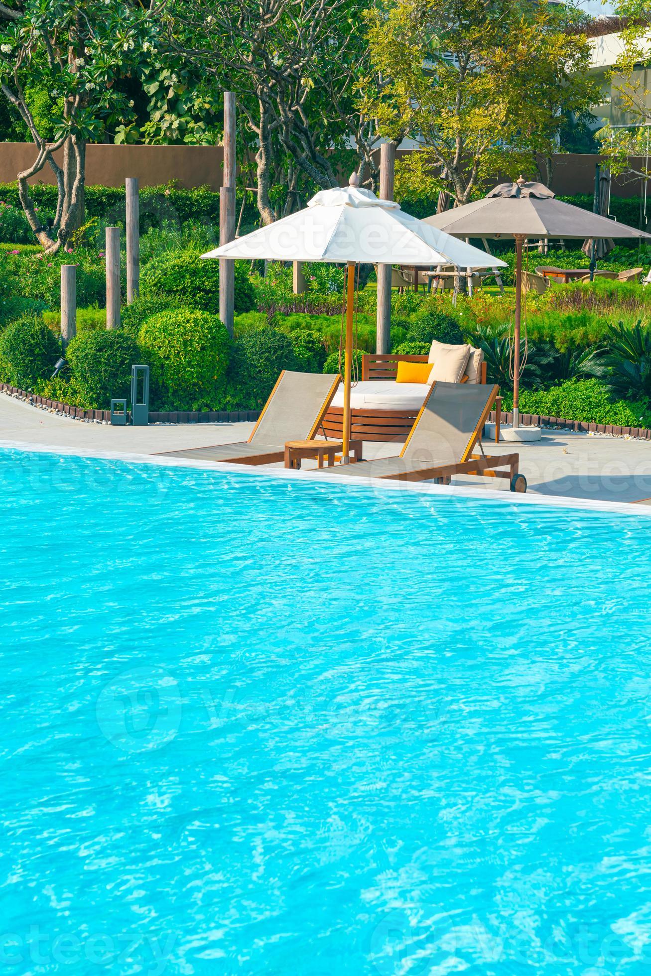 umbrella with bed pool around swimming pool with ocean sea background