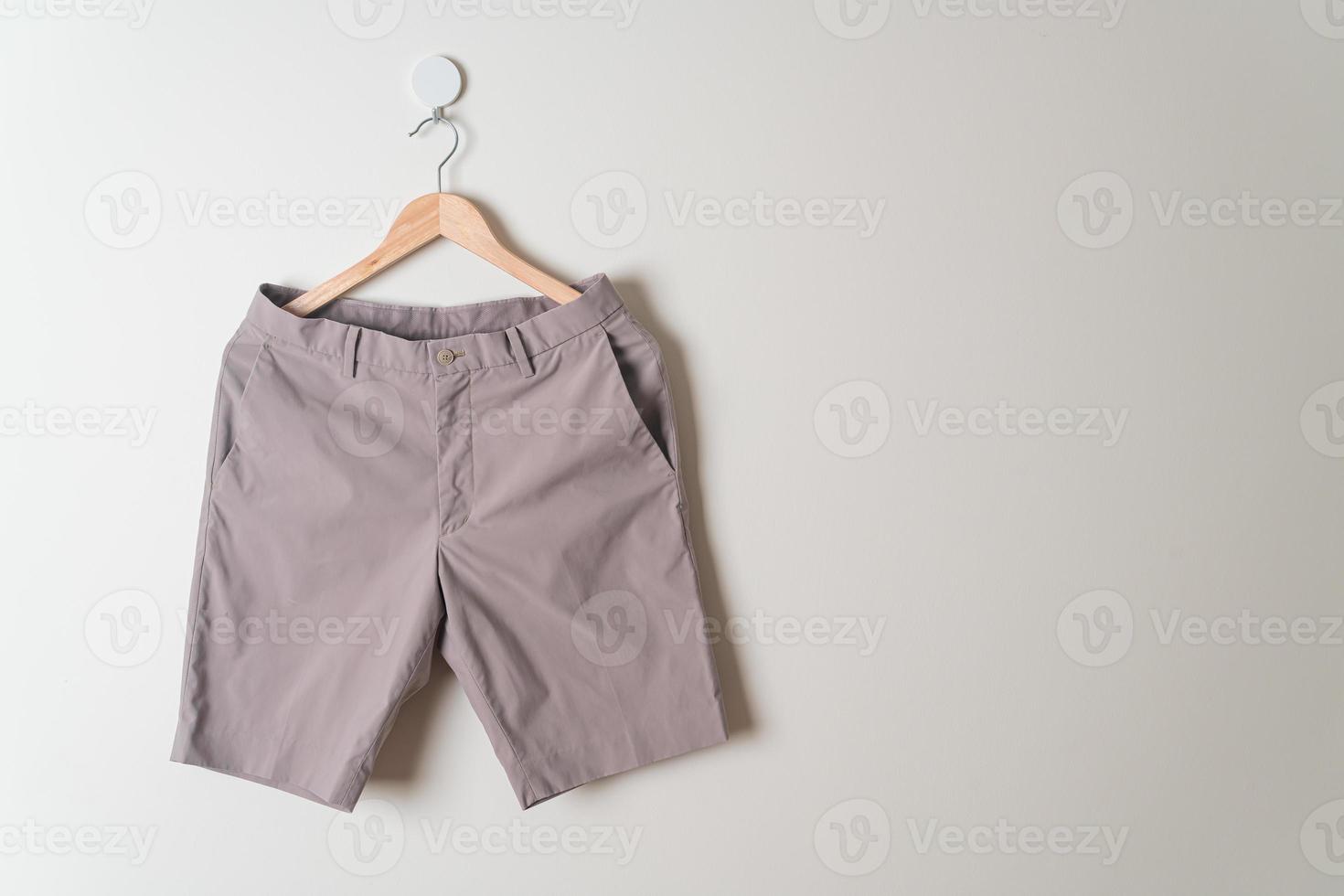 short pants hanging on wall photo