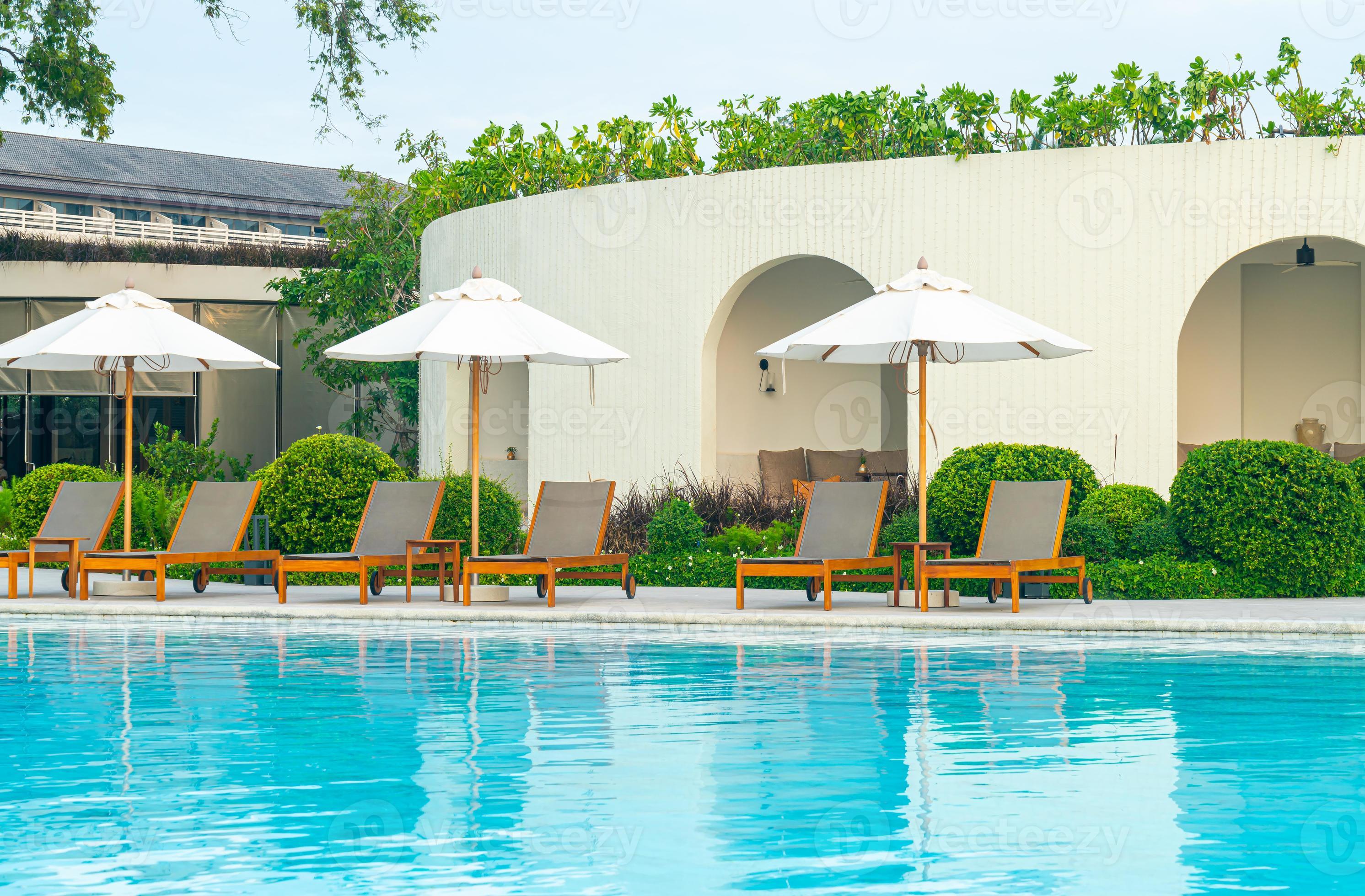 umbrella with bed pool around swimming pool with ocean sea background