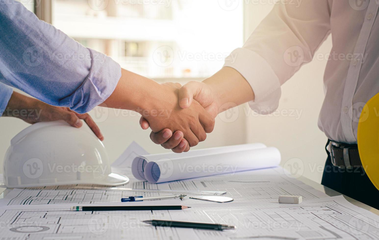 Architects and chief construction engineers work together as a team and exchange ideas. Successful concept office construction site cooperation photo