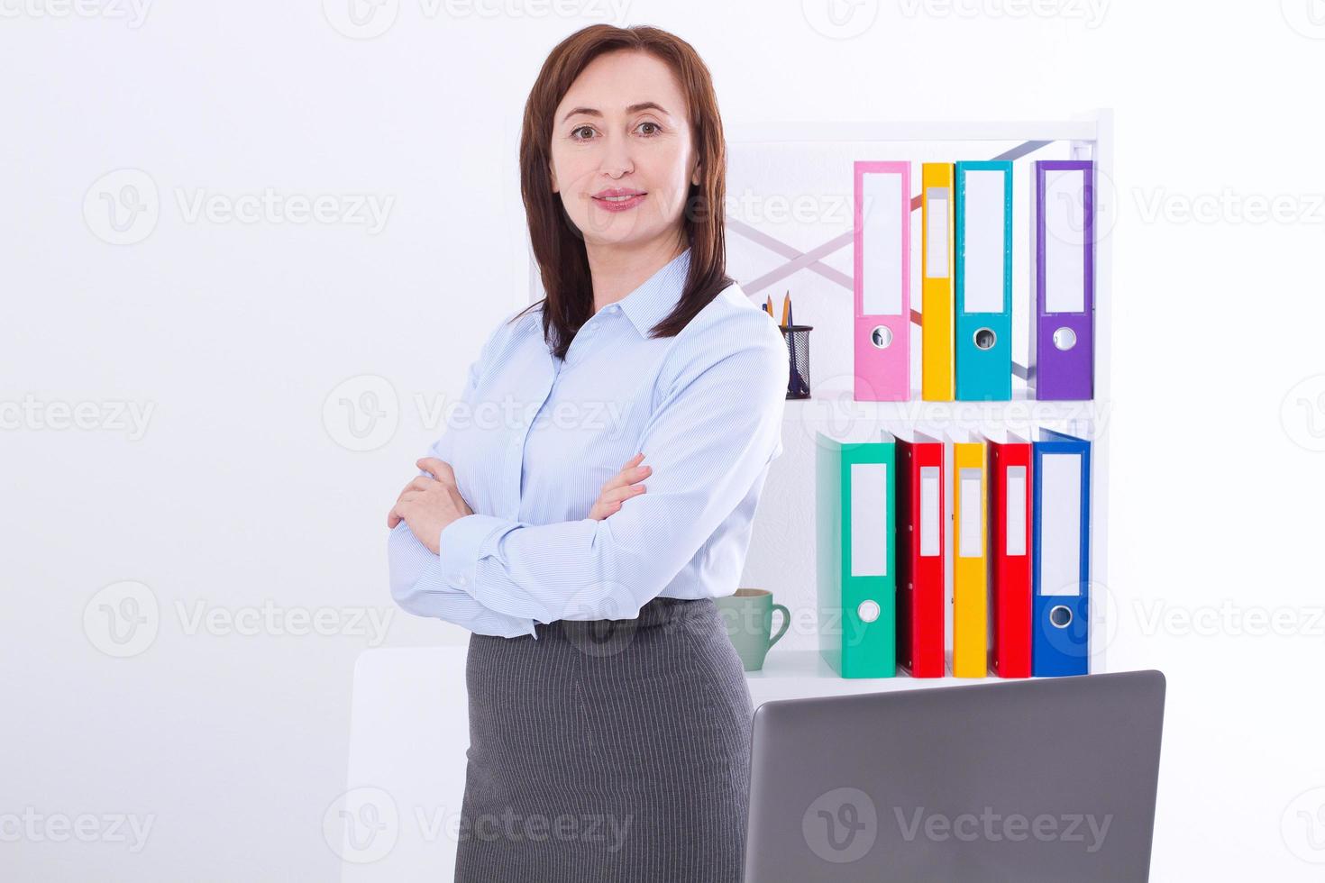 Modern and stylish business woman in the office with copy space and mock up. Teacher at university photo