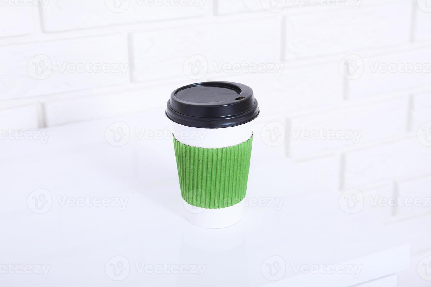 Stylish macro cup of coffee in office. Selective focus and copy space photo