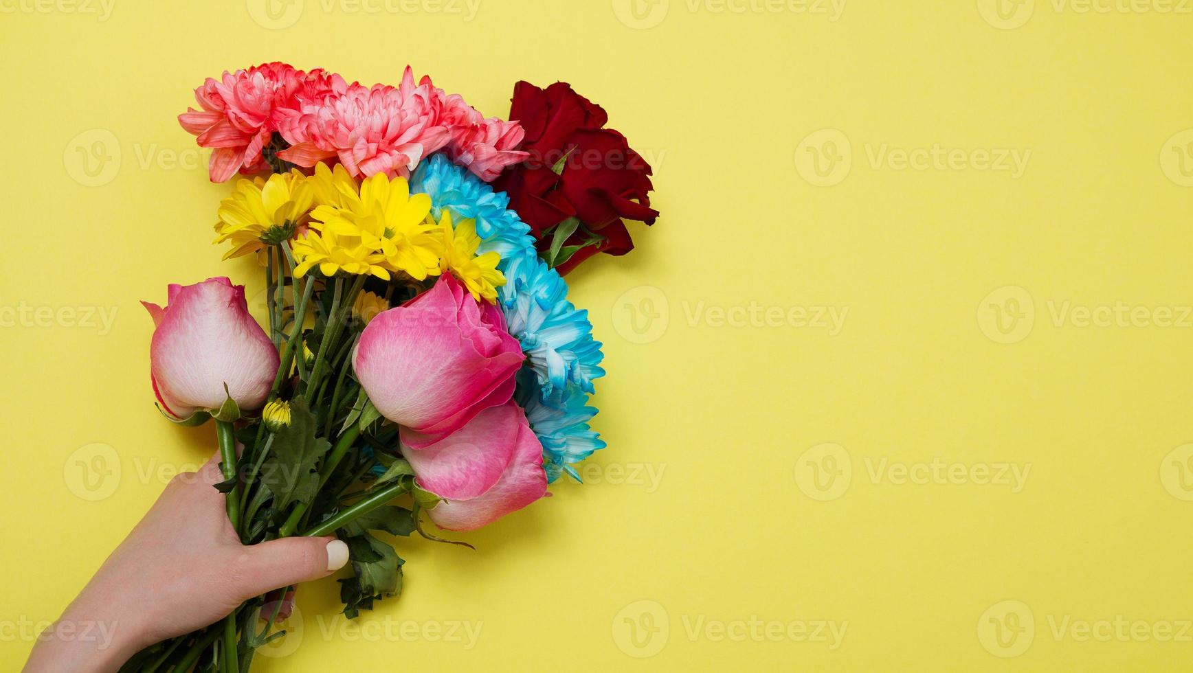Send flowers online concept. Flower delivery for valentine and mother day. Bouquet of red pink roses isolated on violet background. Post card design with beautiful nature rose. Top view. copy space. photo