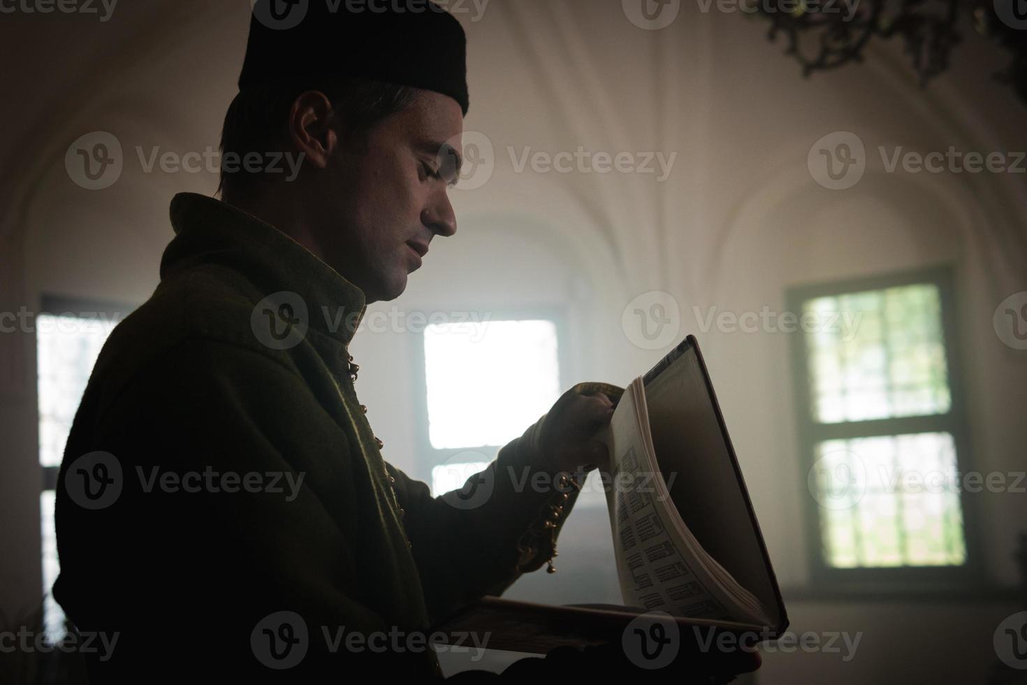 Portrait of a man in a medieval costume. photo