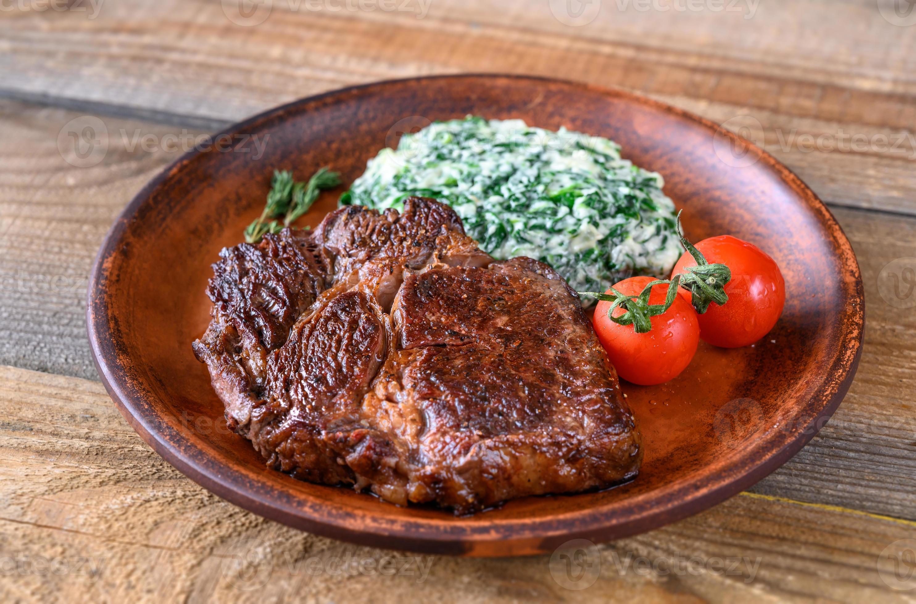 Beef steak with creamy spinach 5372900 Stock Photo at Vecteezy