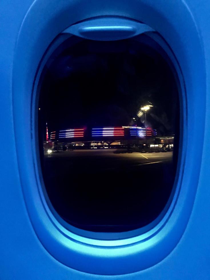 Beautiful view from airplane window, large wing of aircraft shows casement photo