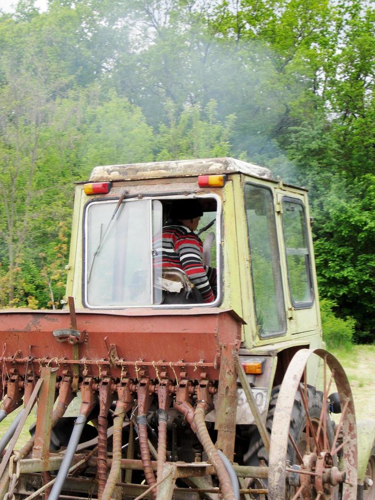 Plowed field by tractor in brown soil on open countryside nature photo
