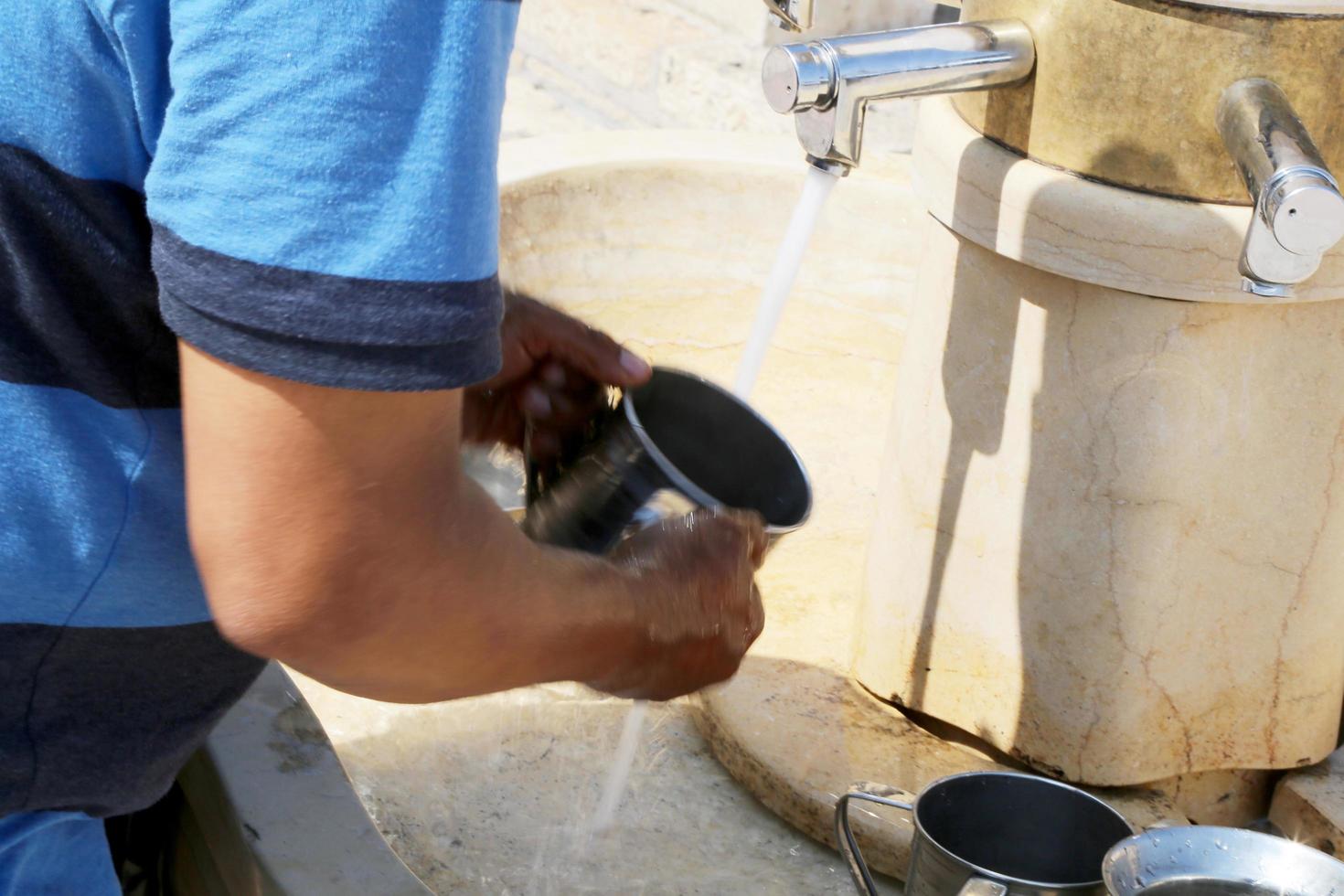 Crane with water and special ritual cups photo