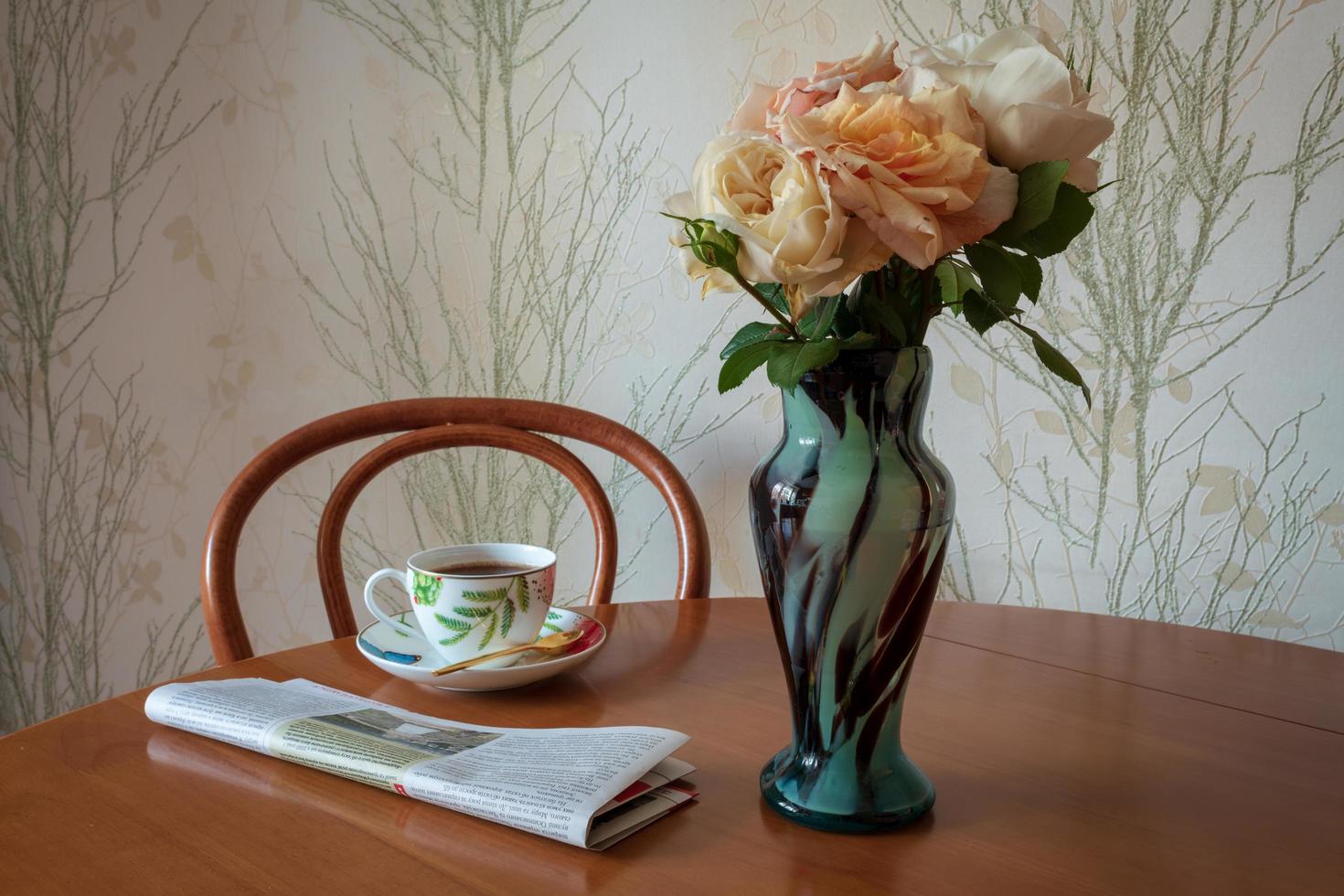 Photography to theme beautiful bouquet roses in vase on wooden table photo