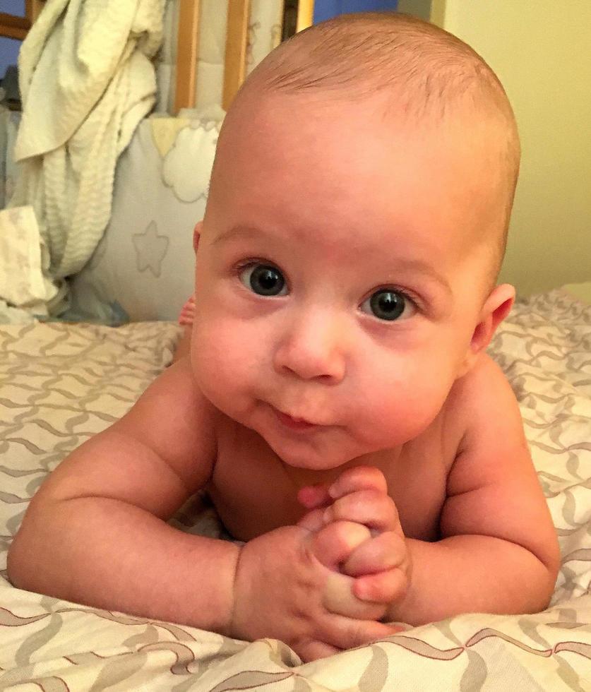 Beautiful baby boy with child face posing photographer photo