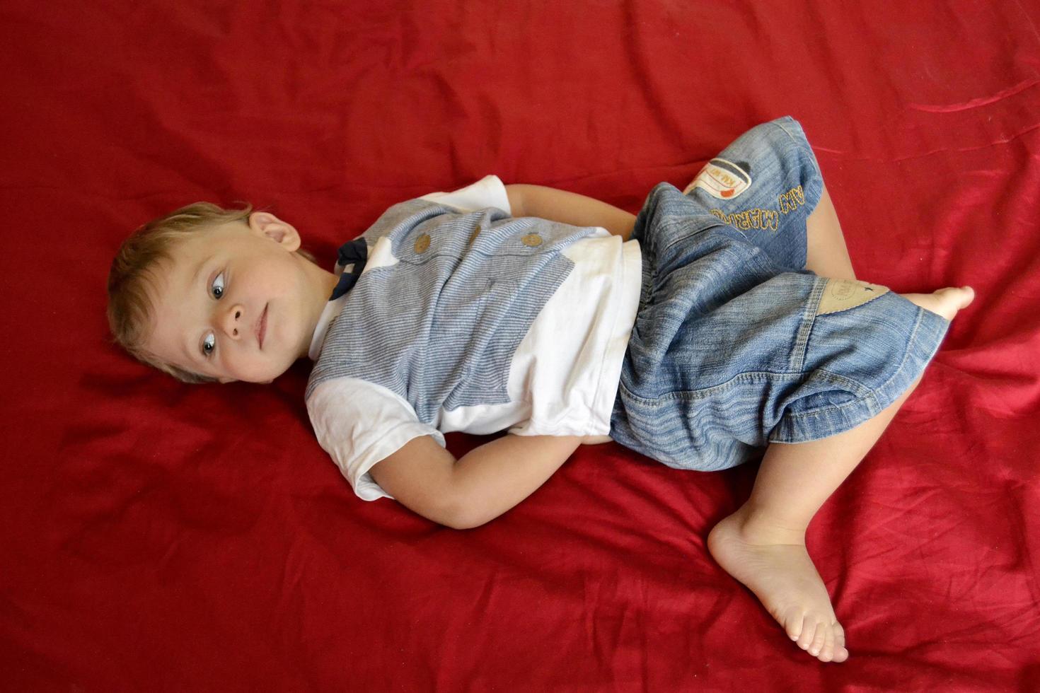 Beautiful baby boy with child face posing photographer photo