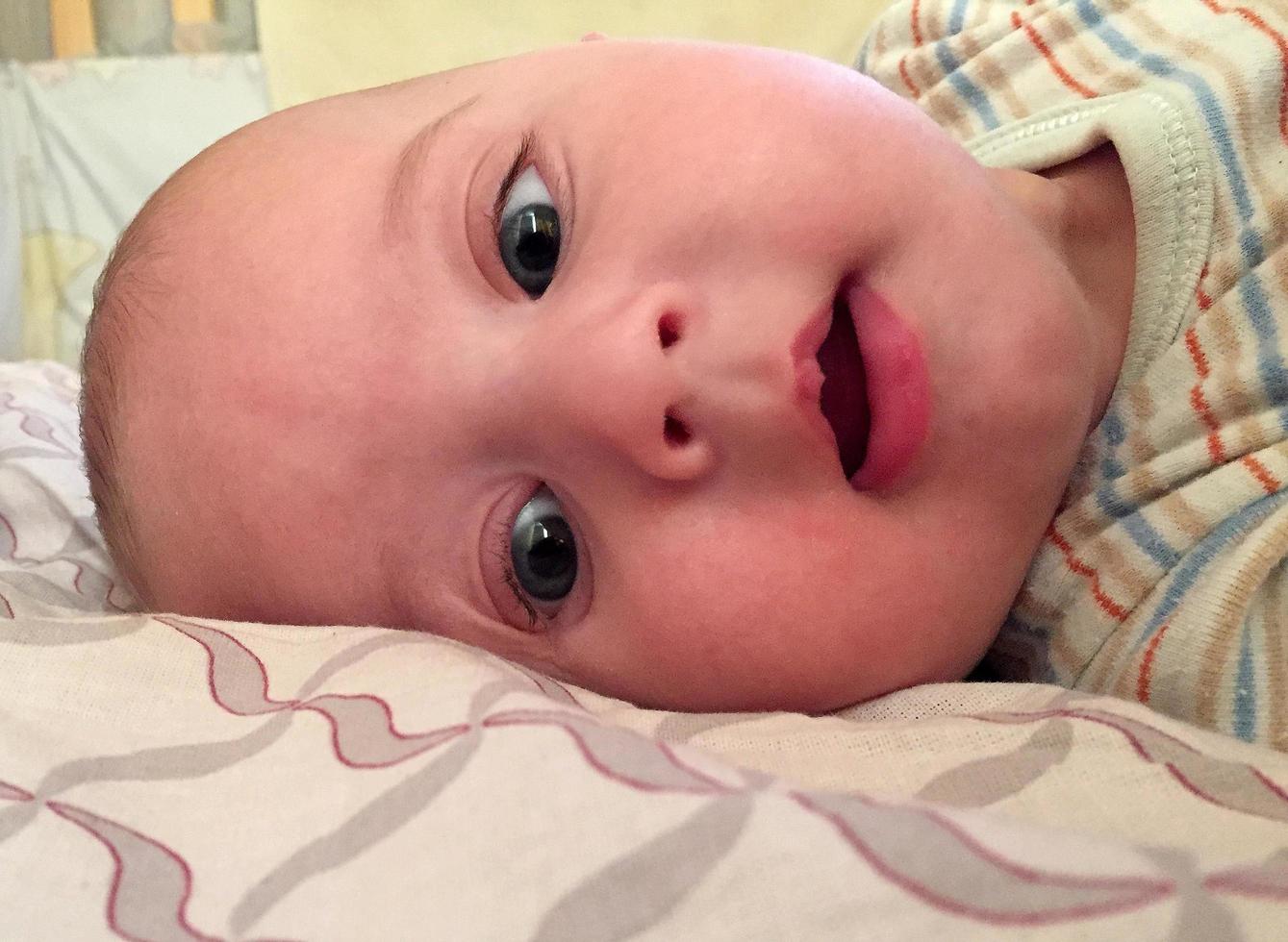 Beautiful baby boy with child face posing photographer photo