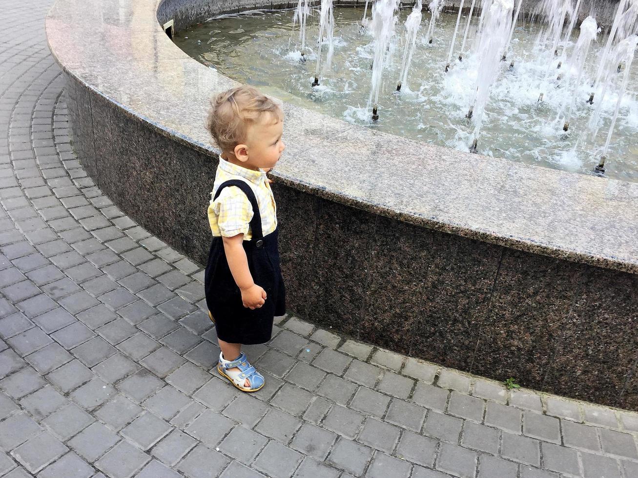 Beautiful baby boy with child face posing photographer photo