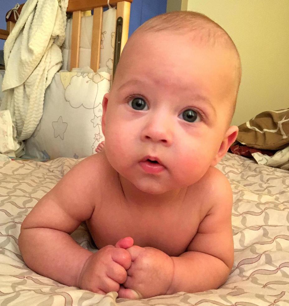 Beautiful baby boy with child face posing photographer photo