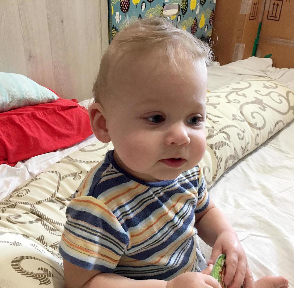 Beautiful baby boy with child face posing photographer photo