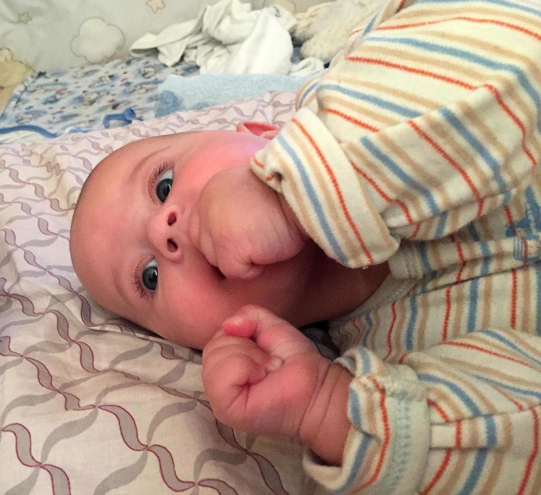 Beautiful baby boy with child face posing photographer photo