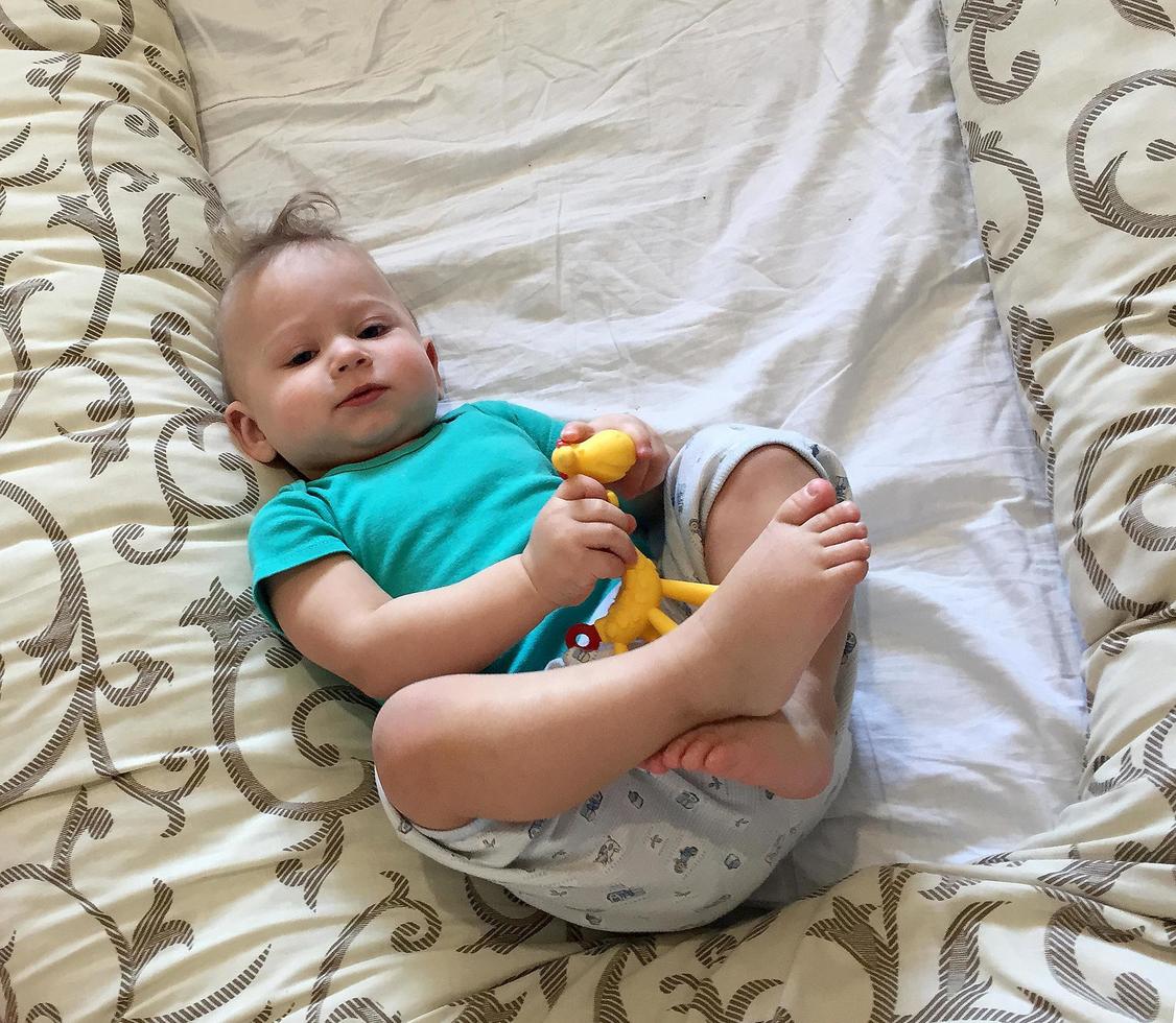 Beautiful baby boy with child face posing photographer photo