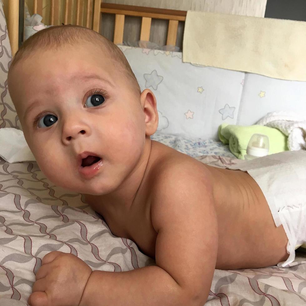 Beautiful baby boy with child face posing photographer photo
