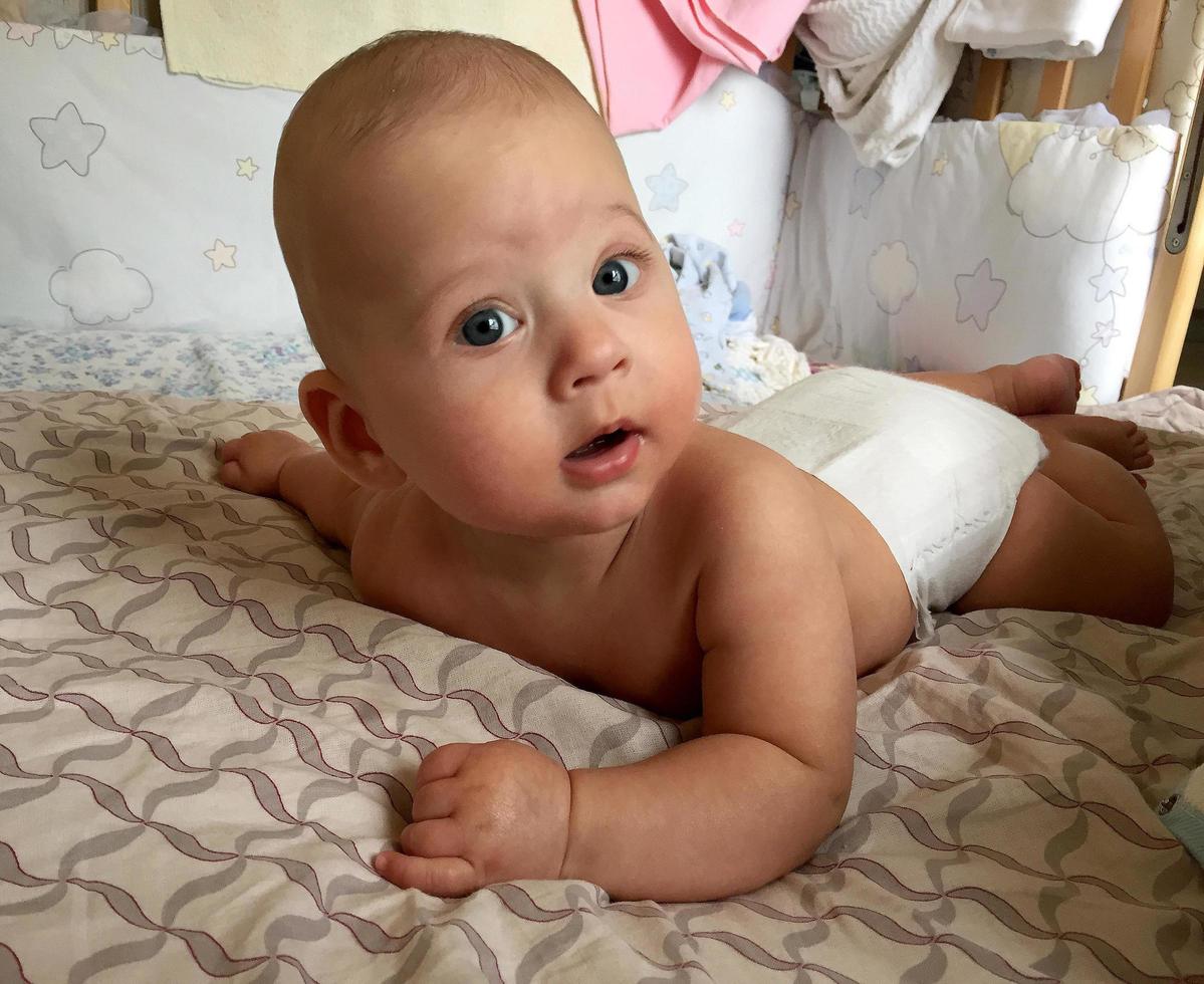 Beautiful baby boy with child face posing photographer photo